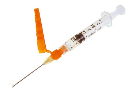3 ml syringe and needle with orange needle guard isolated on white
